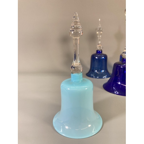 72 - Four late 19th century blue glass bells - largest approx. 31cm high and two blue glass circular bowl... 