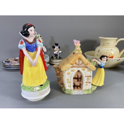 84 - A collection of Disney ceramics and collectables to include Winnie the Pooh jug and bowl, Clover Sno... 