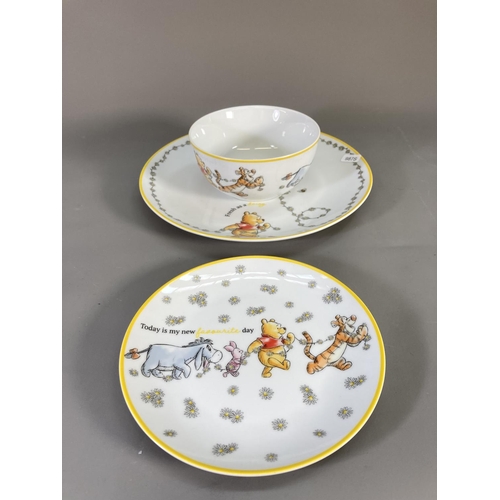 89 - A collection of Disney Winnie the Pooh ceramics to include boxed mug and coaster, bowl, plates etc.