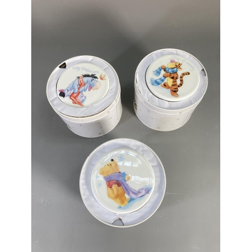 89 - A collection of Disney Winnie the Pooh ceramics to include boxed mug and coaster, bowl, plates etc.