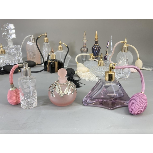 91 - A collection of studio glass atomisers and scent bottles to include Royal Welsh Crystal, Venetian gl... 