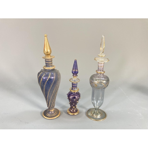 91 - A collection of studio glass atomisers and scent bottles to include Royal Welsh Crystal, Venetian gl... 