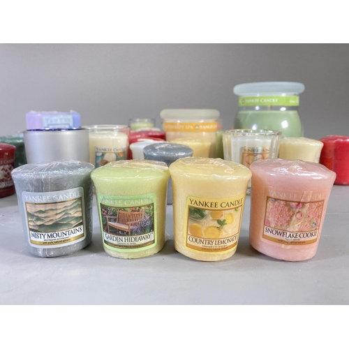 97 - A collection of Yankee Candles to include Tangerine and Vanilla, True Bliss Sage and White Tea, Trop... 