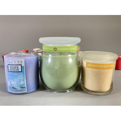 97 - A collection of Yankee Candles to include Tangerine and Vanilla, True Bliss Sage and White Tea, Trop... 