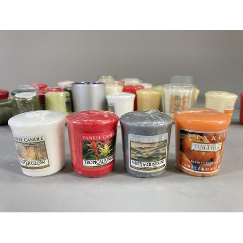 97 - A collection of Yankee Candles to include Tangerine and Vanilla, True Bliss Sage and White Tea, Trop... 