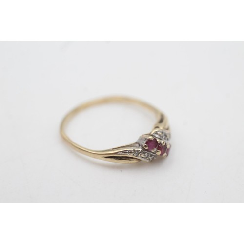 2067 - A 9ct gold ruby and diamond twist band ring, size P - approx. gross weight 1.5 grams