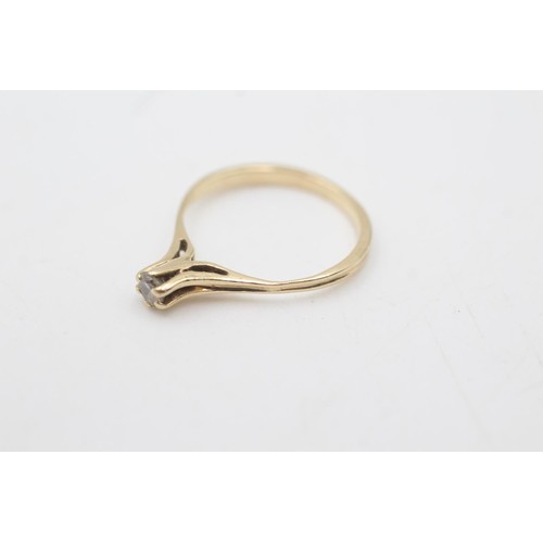 2068 - A 14ct gold diamond solitaire prong setting ring, size M - approx. gross weight 1.5 grams