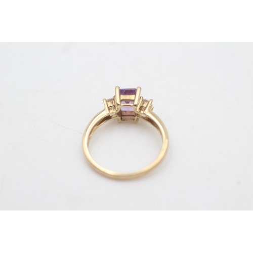 2071 - A 9ct gold amethyst and clear gemstone set ring, size M½ - approx. gross weight 2.4 grams