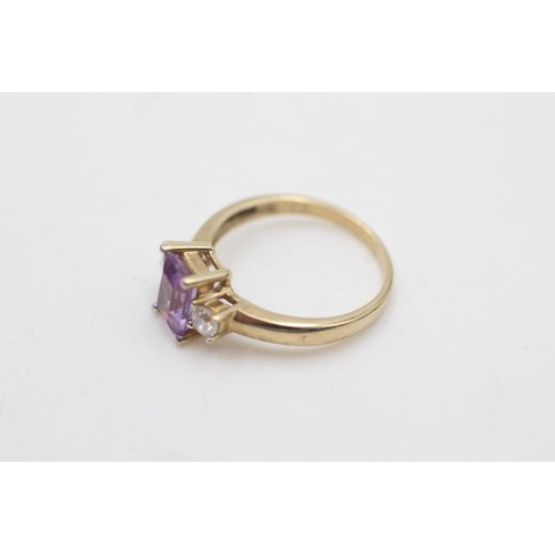 2071 - A 9ct gold amethyst and clear gemstone set ring, size M½ - approx. gross weight 2.4 grams