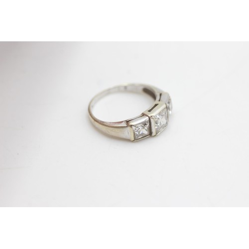 2073 - A 9ct white gold three clear gemstone set ring, size H½ - approx. gross weight 2.6 grams