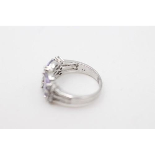 2078 - A 14ct white gold purple and clear gemstone cluster dress ring, N½ - approx. gross weight 3.9 grams