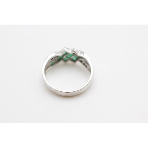 2091 - A 9ct white gold emerald and diamond channel setting crossover ring, size O - approx. gross weight 2... 