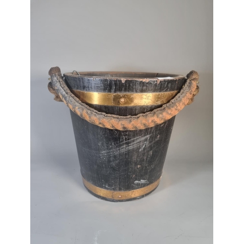 276 - A vintage oak and copper banded bucket with tin liner and rope handle - approx. 31cm high x 31cm dia... 