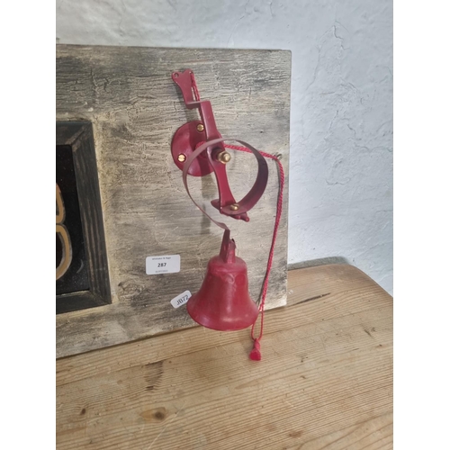 287 - A vintage glass brandy sign with reclaimed wooden frame and red painted servants bell - approx. 122c... 