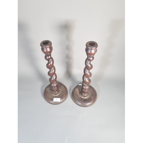 292 - A pair of mid 20th century oak barley twist candle sticks - approx. 36cm high