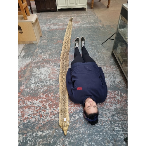 296 - A vintage snakeskin - approx. 388cm long