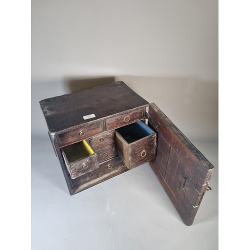 302 - A 17th century oak spice cabinet with fitted interior and geometric moulded door - approx. 32cm high... 