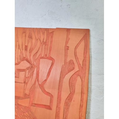 306 - A 20th century orange painted carved wooden wall hanging - approx. 82cm high x 20cm wide x3.5cm deep