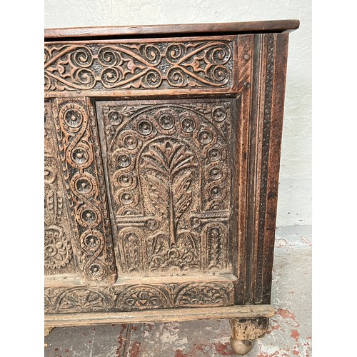 399 - A 16th century heavily carved oak coffer - approx. 82cm high x 123cm wide x 51cm deep