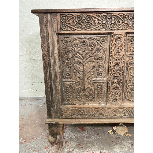 399 - A 16th century heavily carved oak coffer - approx. 82cm high x 123cm wide x 51cm deep