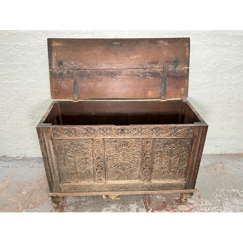 399 - A 16th century heavily carved oak coffer - approx. 82cm high x 123cm wide x 51cm deep