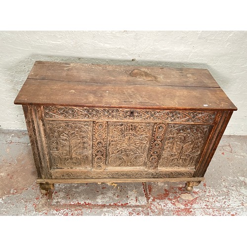 399 - A 16th century heavily carved oak coffer - approx. 82cm high x 123cm wide x 51cm deep