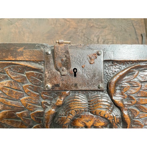 404 - A 17th century oak sword chest with carved cherub design - approx. 56.5cm high x 112cm wide x 39cm d... 