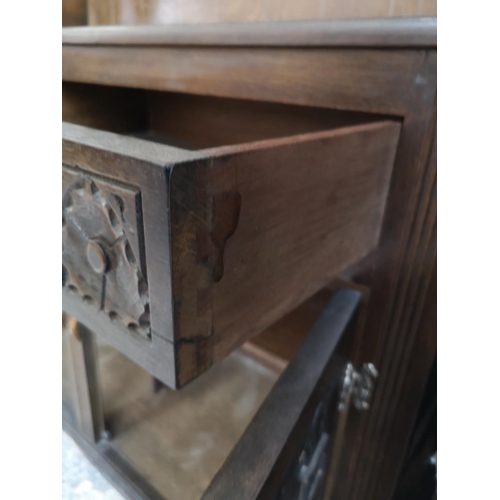 309 - A mid/late 20th century oak Welsh dresser with two upper leaded glass doors, two drawers and two low... 