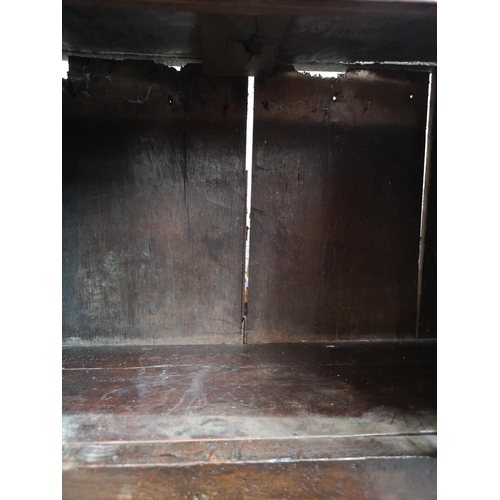 311 - A 17th century oak two door cupboard with Tudor Rose design - approx. 112cm high x 112cm wide x 31cm... 