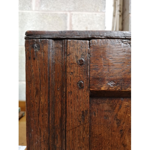 311 - A 17th century oak two door cupboard with Tudor Rose design - approx. 112cm high x 112cm wide x 31cm... 