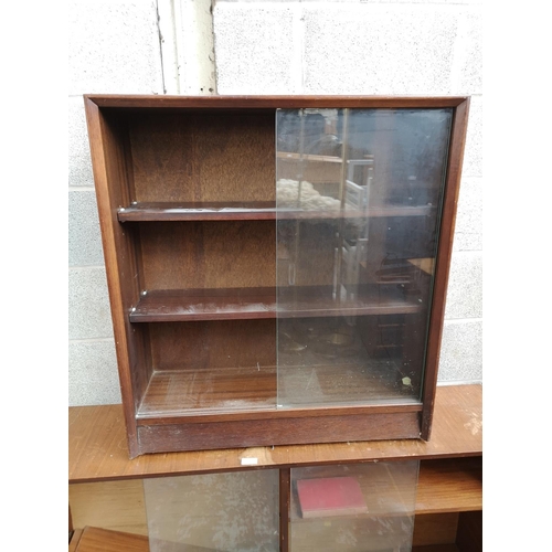 316 - Two mid 20th century tola wood bookcases with glass sliding doors, one approx. 84cm high x 76cm wide... 