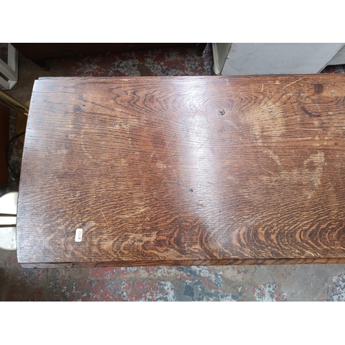 326 - An oak drop leaf gate leg oval dining table - approx. 76cm high x 109cm wide x 132cm extended