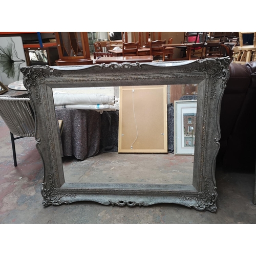 332 - A modern Louis XV style ornate framed bevelled edge wall mirror - approx. 130cm x 104cm