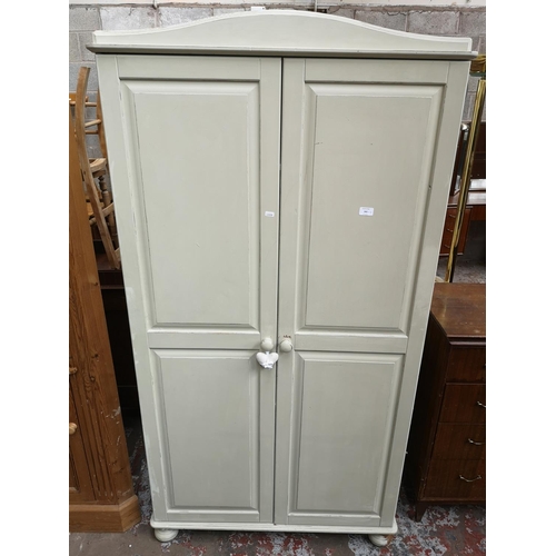 341 - Four pieces of furniture, one dove grey painted double wardrobe, one solid pine free standing corner... 