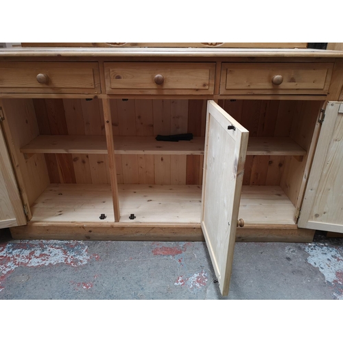 352 - A Victorian style solid pine sideboard with three drawers and three lower cupboard doors - approx. 9... 