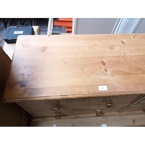 354 - A modern solid pine low chest of four drawers - approx. 57cm high x 135cm wide x 39cm deep