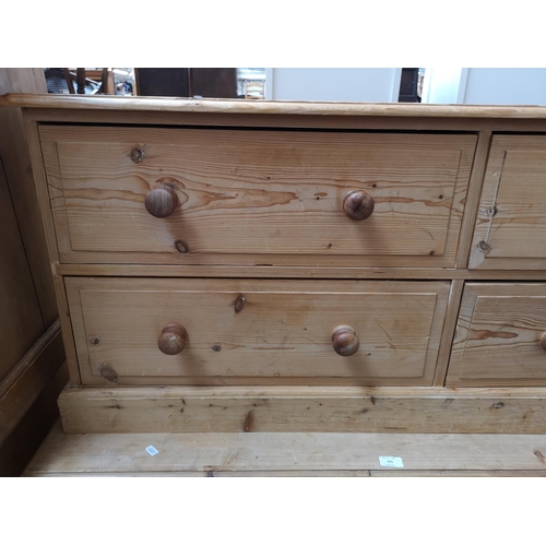 354 - A modern solid pine low chest of four drawers - approx. 57cm high x 135cm wide x 39cm deep