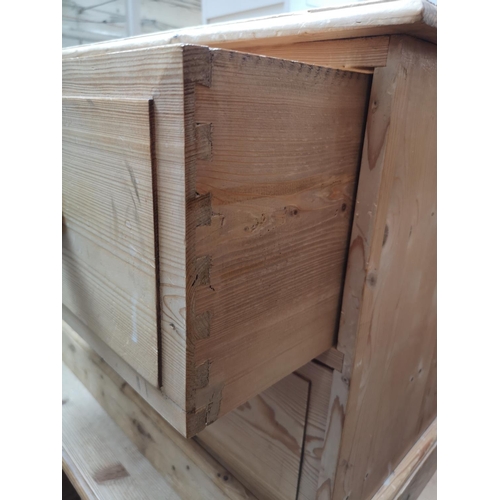 354 - A modern solid pine low chest of four drawers - approx. 57cm high x 135cm wide x 39cm deep