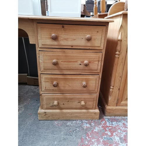 355 - A Victorian style solid pine pedestal desk with single cupboard door and four drawers - approx. 76cm... 