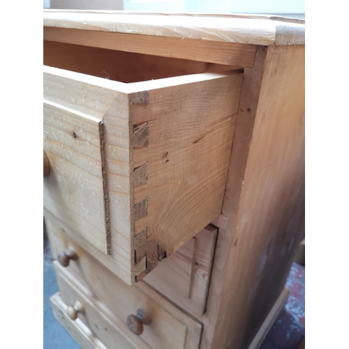 355 - A Victorian style solid pine pedestal desk with single cupboard door and four drawers - approx. 76cm... 