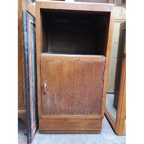 368 - Three pieces of oak furniture, two Art Deco bedside cabinets and one early/mid 20th century wall mir... 