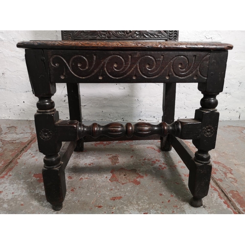 373 - A 19th century Gothic Revival carved oak side chair with lower stretcher and Green Man design - appr... 