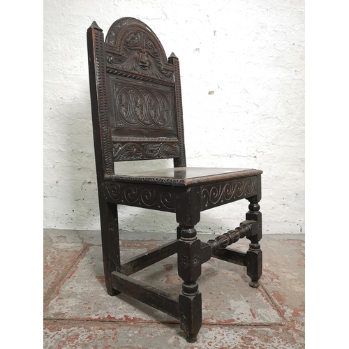 373 - A 19th century Gothic Revival carved oak side chair with lower stretcher and Green Man design - appr... 