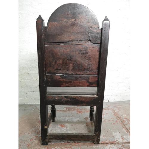 373 - A 19th century Gothic Revival carved oak side chair with lower stretcher and Green Man design - appr... 