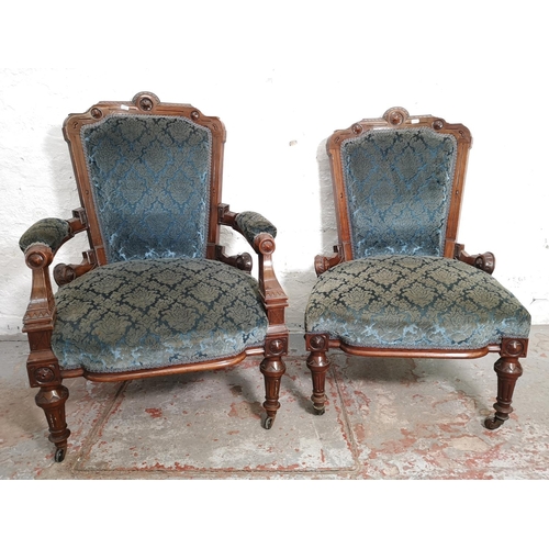 375 - A late Victorian carved walnut and blue upholstered three piece parlour suite comprising double spoo... 