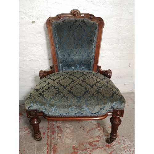 375 - A late Victorian carved walnut and blue upholstered three piece parlour suite comprising double spoo... 