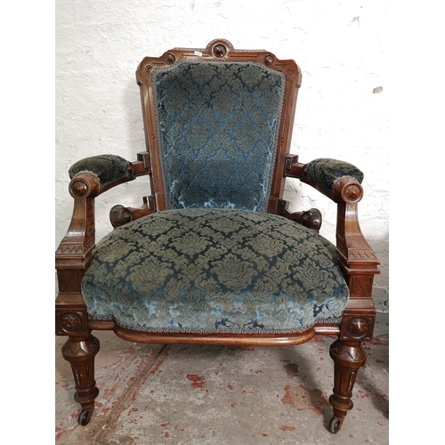 375 - A late Victorian carved walnut and blue upholstered three piece parlour suite comprising double spoo... 