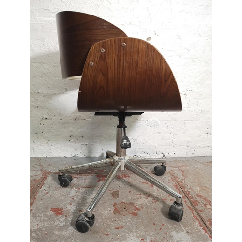 376 - An Eames style walnut effect and white leatherette swivel adjustable desk chair