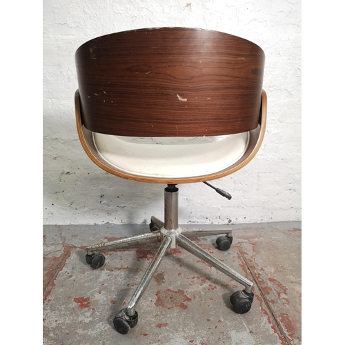 376 - An Eames style walnut effect and white leatherette swivel adjustable desk chair