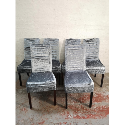 389 - A set of six modern cream leatherette dining chairs with silver crushed velvet chair covers